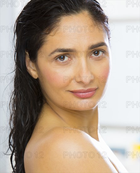 Mixed race woman with wet hair