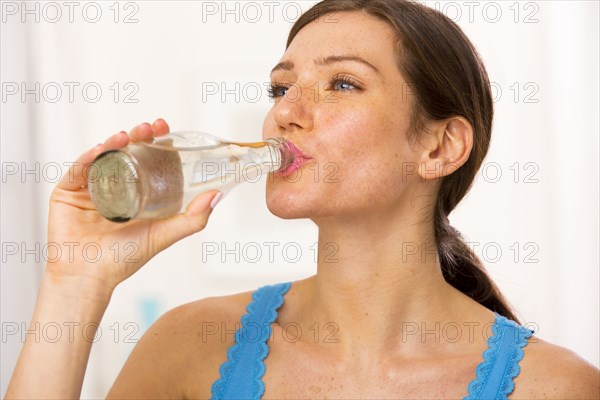 Caucasian woman drinking water