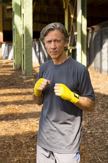 Caucasian boxer with fists raised