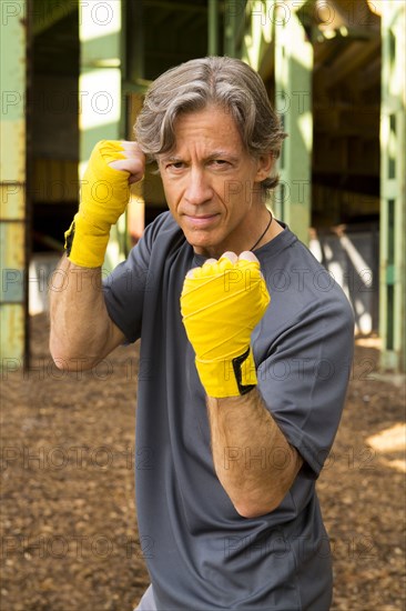 Caucasian boxer with fists raised