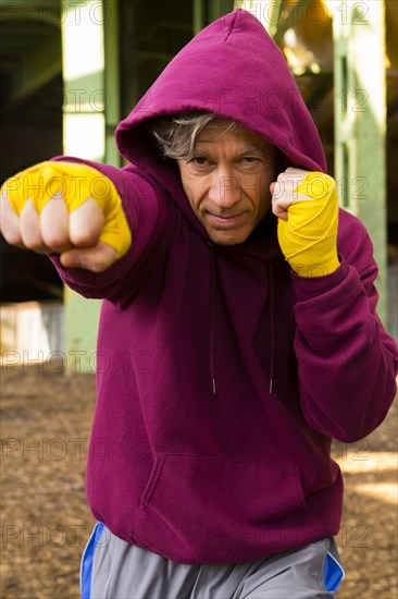 Caucasian boxer with fists raised