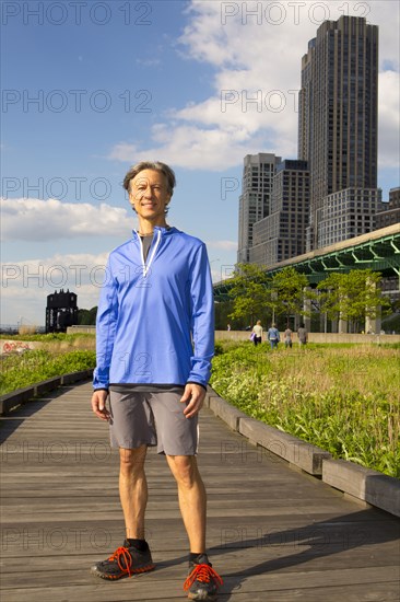 Caucasian man standing in urban park