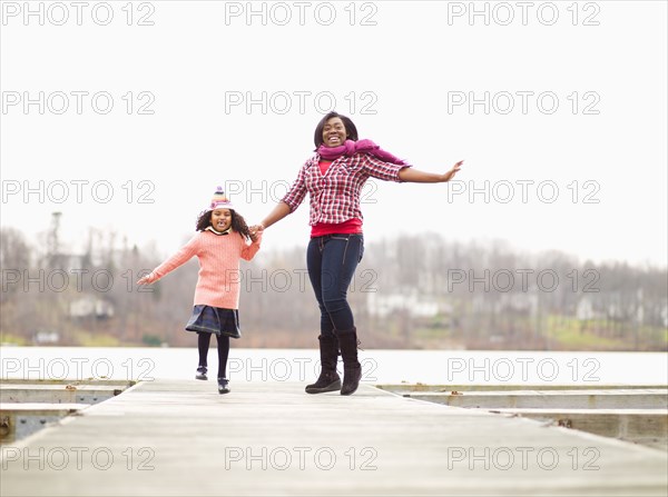 Mother and daughter enjoying walking outdoors