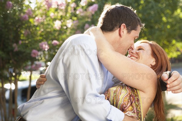 Elegant Caucasian couple hugging