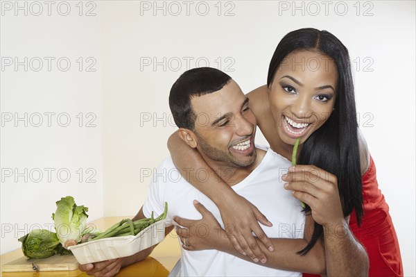 Couple eating vegetables together