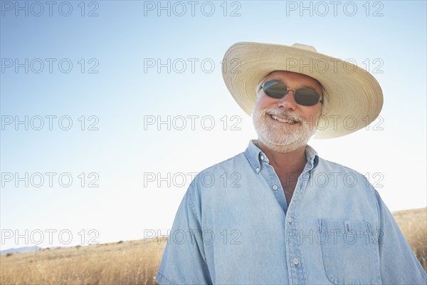 Caucasian man smiling in desert landscape