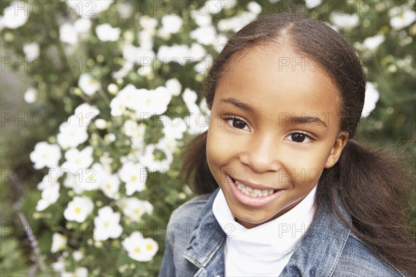 Mixed race girl smiling outdoors