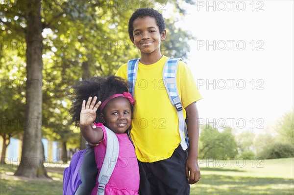 Mixed race children smiling together