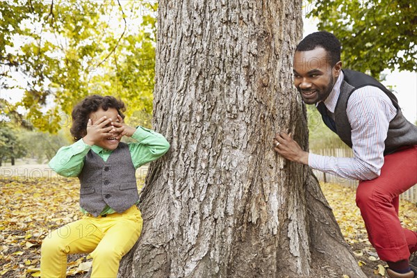 Father and son playing in park