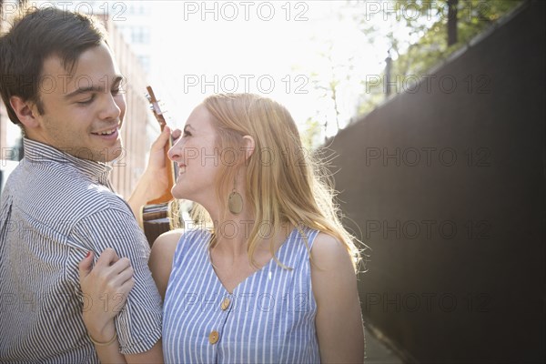 Caucasian couple standing in city