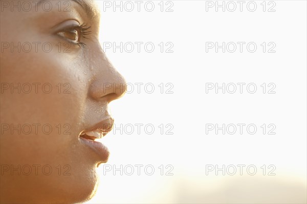 Profile of sweating Hispanic woman
