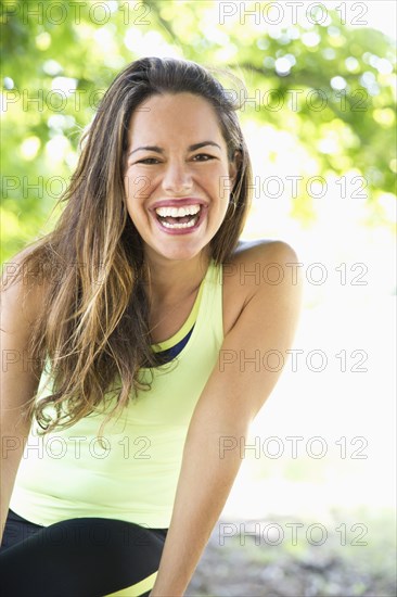 Mixed race woman laughing outdoors