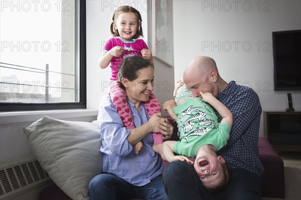 Family playing in living room