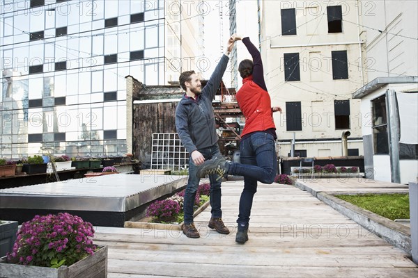 Couple dancing on urban rooftop