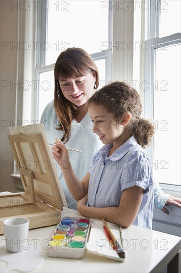 Mother and daughter painting