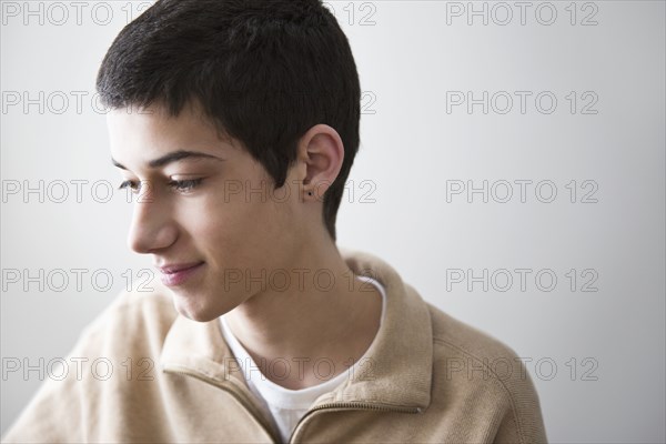 Mixed race teenage boy smiling