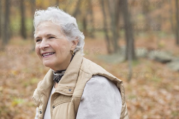 Caucasian woman smiling outdoors in autumn