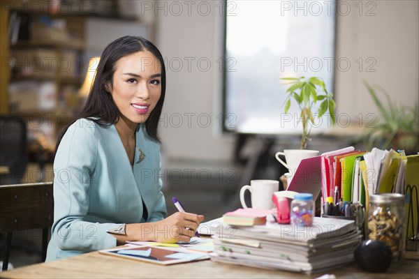 Thai transgender businesswoman working in office