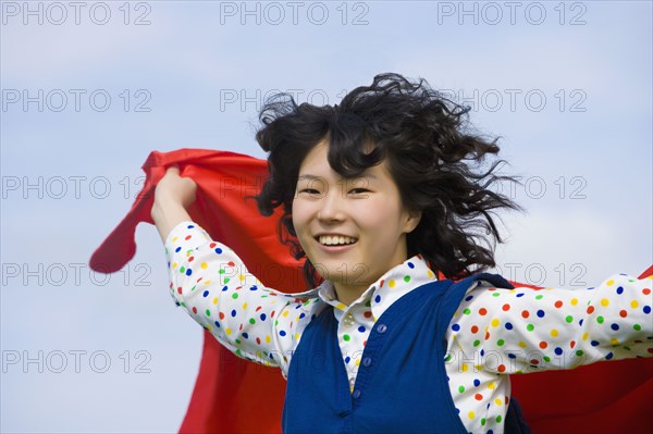 Asian woman with hair blowing