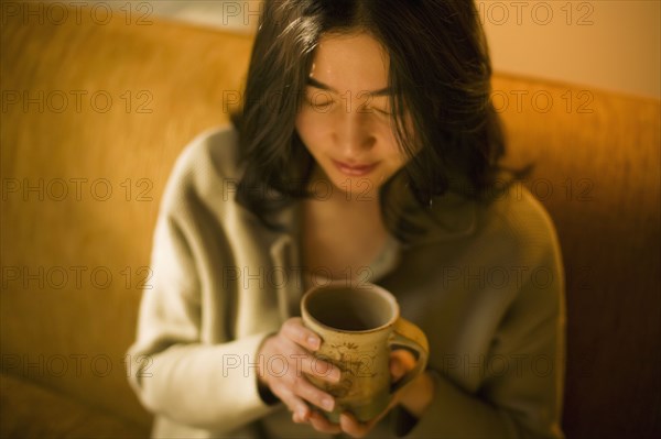 Asian woman drinking tea