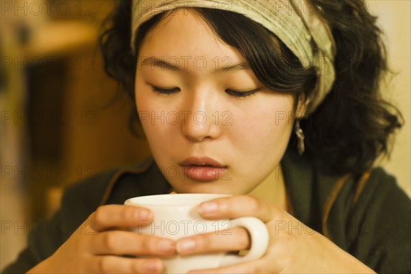 Asian woman drinking tea
