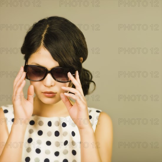 Asian woman wearing sunglasses