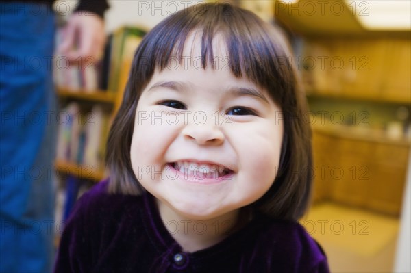 Close up of mixed race girl grinning