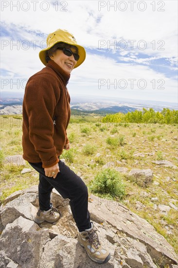 Japanese woman hiking in mountain terrain