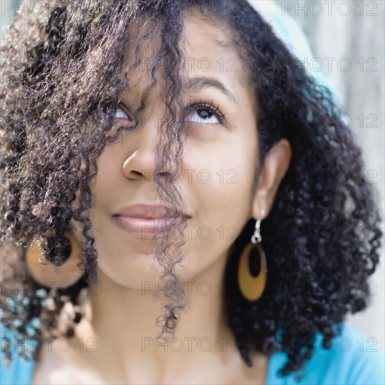 Glamorous mixed race woman looking up