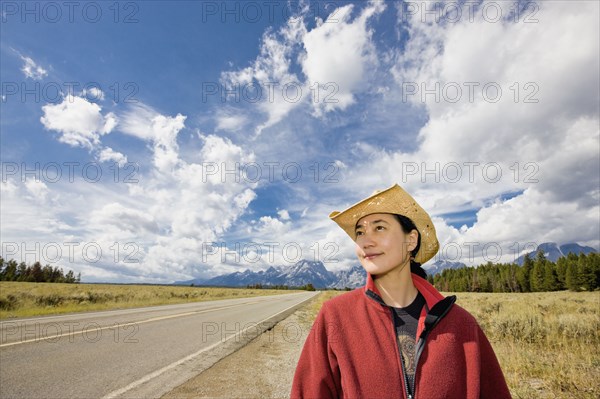 Asian woman on remote highway