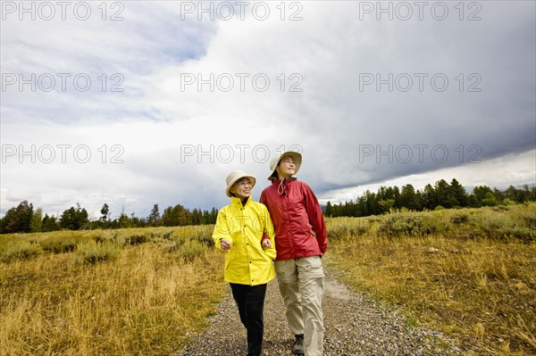 Japanese mother and daughter hiking in remote area
