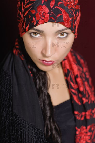 Mixed race woman wearing headscarf