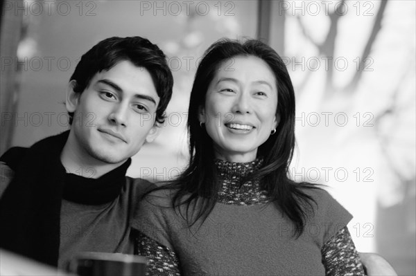 Asian mother smiling with son