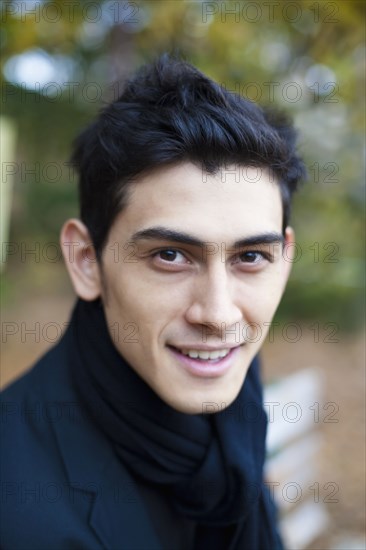 Close up of smiling mixed race man