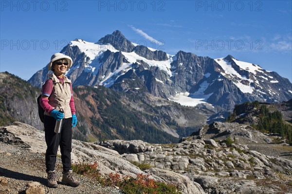 Japanese woman hiking near mountain