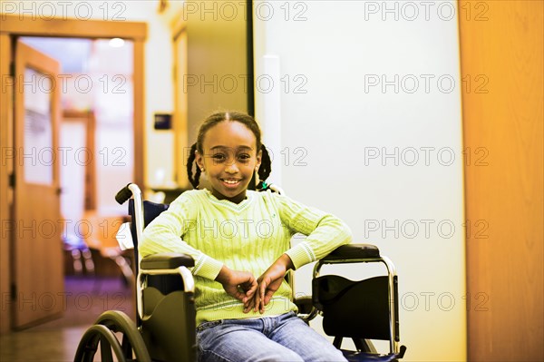 African American girl sitting in wheelchair