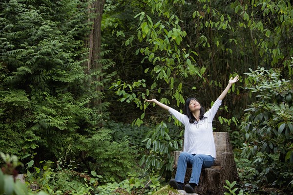 Japanese woman cheering in garden