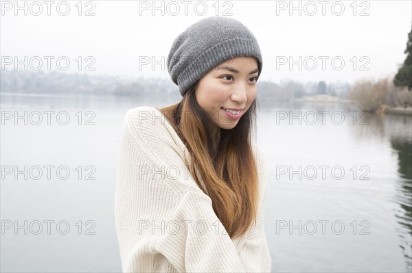 Japanese woman standing near lake