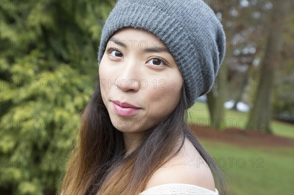 Japanese woman wearing beanie outdoors