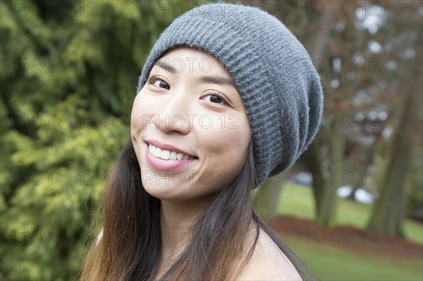 Japanese woman wearing beanie outdoors
