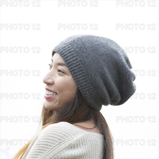 Japanese woman wearing beanie outdoors