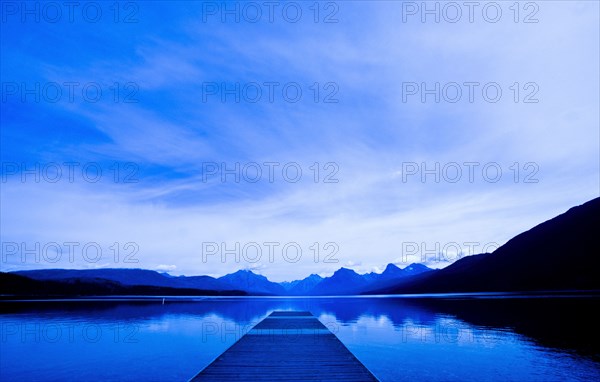 Wooden dock over still remote lake