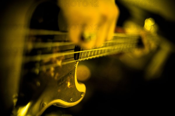 Close up of musician playing guitar