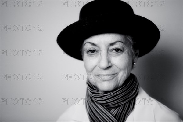 Smiling Caucasian woman wearing scarf and hat