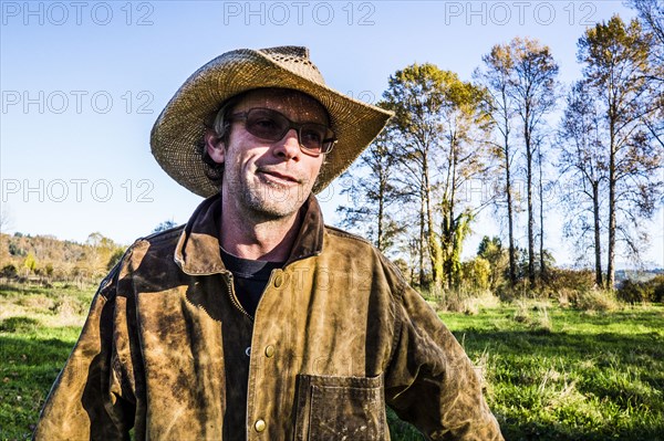 Caucasian farmer wearing cowboy hat outdoors