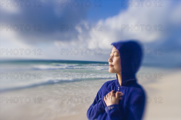 Japanese woman relaxing on beach