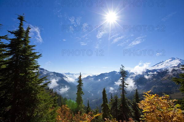 Sun over autumn mountain landscape