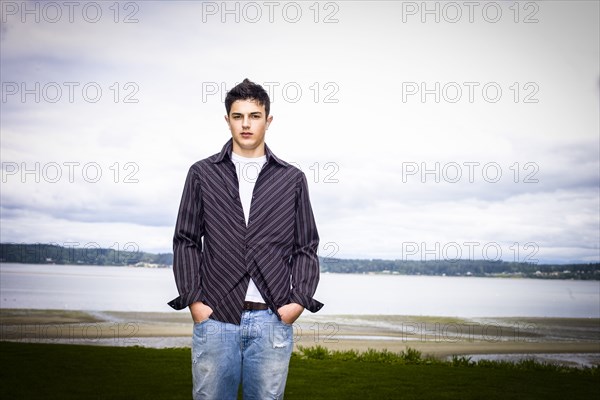 Portrait of Mixed Race man standing at beach