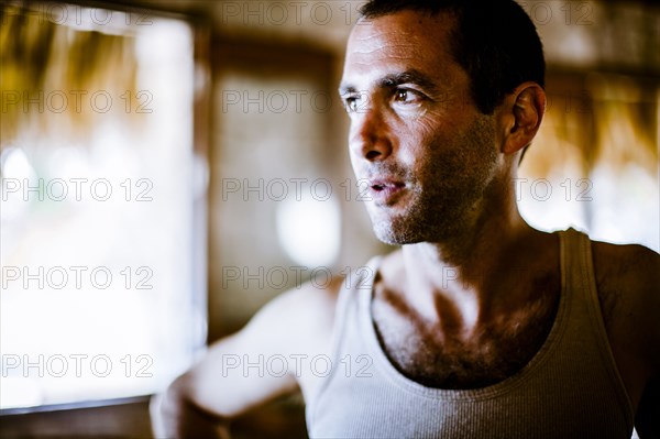 Serious man wearing tank-top