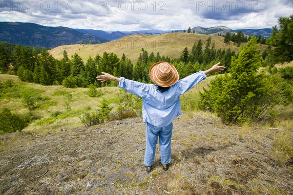 Japanese woman enjoying scenic view of landscape